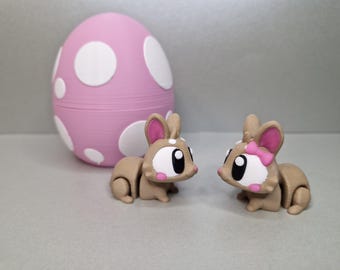 uf surprise de lapin de Pâques avec 4 figurines de lapin