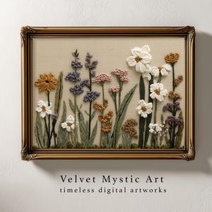 May include: Embroidered floral artwork in a gold-toned frame. The artwork features a variety of colorful flowers, including white, yellow, purple, and pink blooms, with green stems and leaves. The text "Velvet Mystic Art timeless digital artworks" is at the bottom.