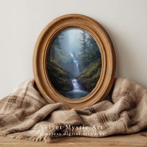 May include: An oval-shaped framed painting of a waterfall cascading through a lush green forest. The artwork is set in a distressed, light brown wooden frame. The words "Velvet Mystic Art" and "timeless digital artworks" are printed at the bottom.