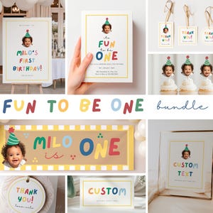 Könnte beinhalten: Eine Sammlung farbenfroher Dekorationen und Schreibwaren für eine Geburtstagsfeier. Enthält ein Willkommensschild, eine Einladung, Geschenkanhänger und Essensetiketten. Das Thema ist "Fun to be One" mit einem Foto eines Kindes mit Partyhut.