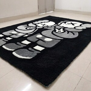 Large handmade hand tufted cartoon area rug featuring black and white character design, custom tufted rug, hypebeast room decor, aesthetic bedroom rug, streetwear inspired carpet, soft plush handmade floor mat, modern living room rug, gamer room decor, luxury tufted carpet, unique home decor gift, premium acrylic yarn rug, custom size area rug, black white statement rug, cozy bedroom carpet, trendy floor covering, handmade artistic rug for home decoration