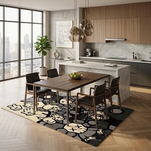 May include: A rectangular area rug featuring a repeating graphic pattern of cartoon-style gloved hands and skull-like faces in shades of cream, gray, and black, positioned beneath a wooden dining table with four dark chairs in a modern kitchen.