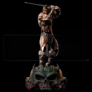 May include: A detailed figurine of a muscular, blonde-haired warrior holding a sword aloft. The figure is clad in dark armour and stands atop a skull-shaped base. The overall colour palette is dark with highlights on the figure's physique.
