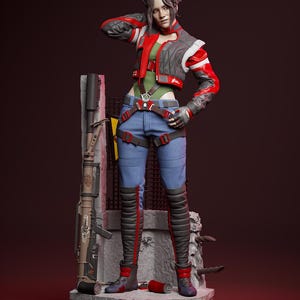 Può includere: Statuetta dettagliata di una persona con giacca rossa, grigia e bianca, top verde e jeans blu. La figura è in posa con una mano sulla testa. Un fucile e una struttura in pietra sono dietro la figura.