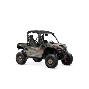 Puede incluir: Un vehículo lado a lado Yamaha RMAX gris y negro con neumáticos grandes y resistentes. El vehículo tiene una jaula antivuelco, dos asientos y detalles en rojo. La palabra "RMAX" es visible en el lateral.