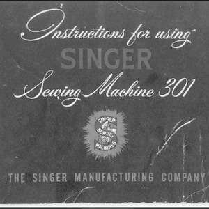 May include: A vintage instruction manual for the Singer Sewing Machine 301. The cover is dark gray with white text in a decorative font. The Singer logo is in the center, and the text "The Singer Manufacturing Company" is at the bottom.
