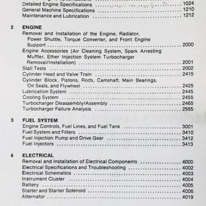 Puede incluir: Tabla de contenidos de un manual de 580K Loader Backhoe. El documento enumera secciones sobre seguridad general, componentes del motor, sistemas de combustible, sistemas eléctricos y mecanismos de dirección. Texto negro sobre fondo blanco.