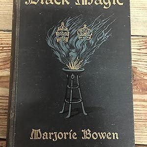 May include: A vintage book titled "Black Magic" by Marjorie Bowen. The cover is dark with gold lettering and a stylized illustration of a burning brazier with two crowns above it. The book has a worn appearance.