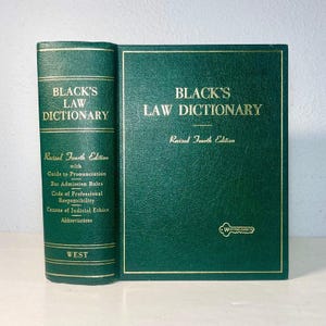 May include: A green hardcover book titled "Black's Law Dictionary, Revised Fourth Edition." The book's spine displays the title and publisher, "West." The cover features gold lettering and a gold border.