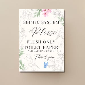 Pode incluir: Um letreiro retangular com o texto "SEPTIC SYSTEM Please FLUSH ONLY TOILET PAPER .AND NATURAL WASTE. Thank you." Decorado com ilustrações florais e de pássaros em preto e branco, com toques de rosa e azul.