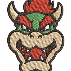 Peut inclure: Un gros plan sur le visage de Bowser de la série de jeux vidéo Super Mario Bros. L'image est un patch brodé avec un schéma de couleurs rouge, vert et marron.