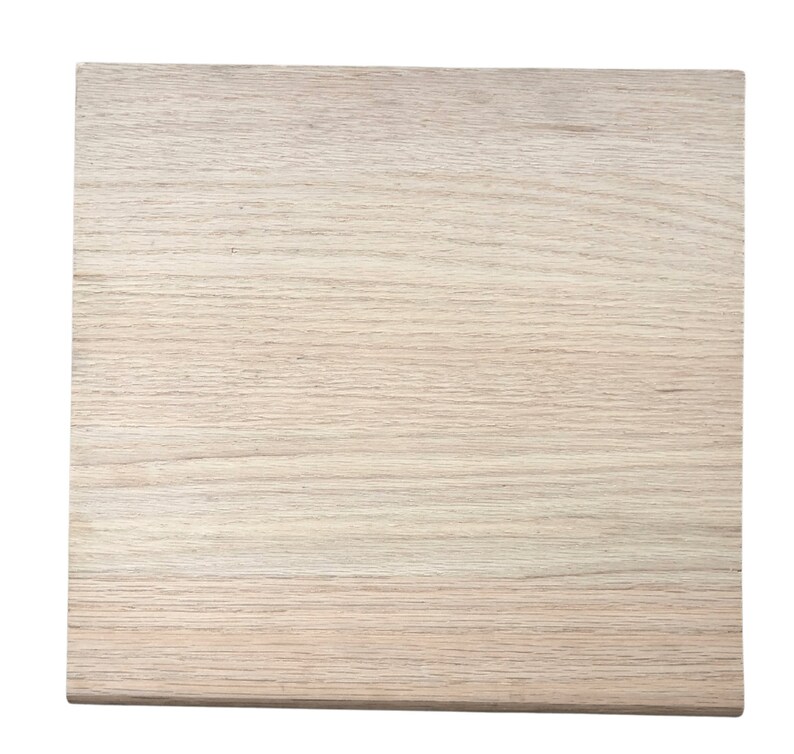 May include: A light brown wooden board with a smooth surface and a natural wood grain pattern.