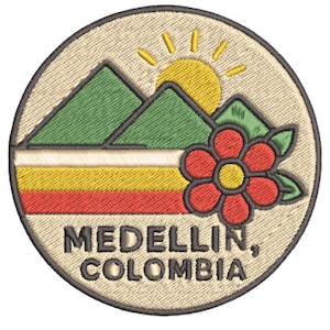 May include: Embroidered patch featuring a circular design with the text "MEDELLIN, COLOMBIA." The patch includes green mountains, a yellow sun, a red flower, and horizontal stripes in white, yellow, and red.