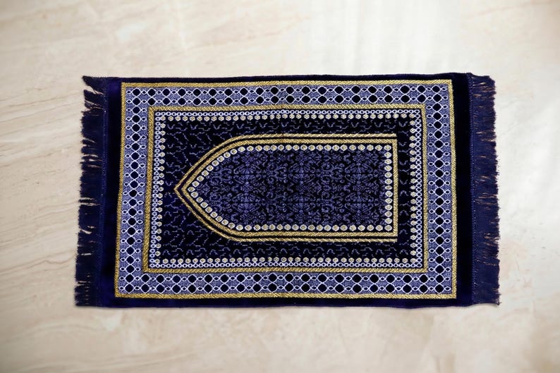 handwoven turkish prayer rug, seccade islamic prayer mat, velvet texture rug, floral border prayer rug, soft salah mat, muslim home decor rug, prayer room accessory, ramadan kareem gift, eid mubarak present, hajj umrah gift, portable travel prayer mat, compact lightweight mat, traditional turkish pattern, ethnic motif carpet, sajjadah worship mat, comfortable kneeling pad, prayer corner essentials, qibla corner decor, woven cotton blend,