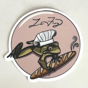 Bakery Frog Matte Vinyl Sticker – Cute Frog Baking Bread, Cozy Animal Vinyl Sticker, Whimsical Doodle Art