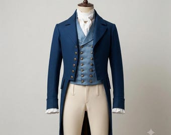 May include: A dark blue tailcoat jacket worn over a light blue double-breasted waistcoat with brass buttons. The ensemble includes a white collared shirt with a white cravat at the neck and cream-colored trousers, all displayed on a mannequin.