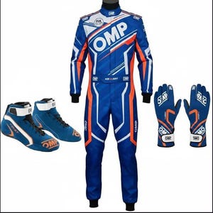 May include: A blue and orange racing suit, gloves, and shoes set. The suit features white accents and the "OMP" logo. The gloves and shoes are also blue with orange and white details. The shoes have the word "FIRST" on them.