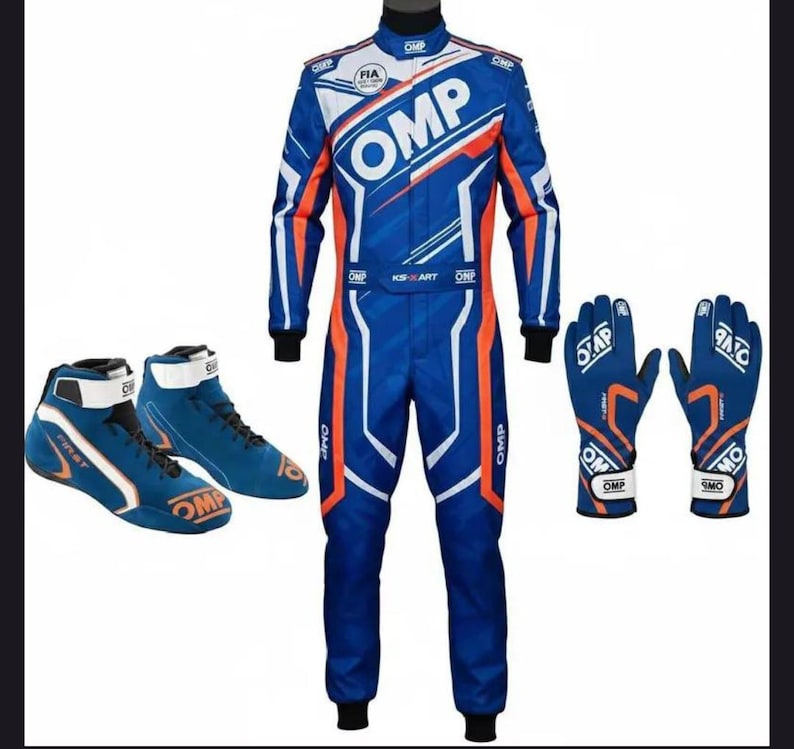 May include: A blue and orange racing suit, gloves, and shoes set. The suit features white accents and the "OMP" logo. The gloves and shoes are also blue with orange and white details. The shoes have the word "FIRST" on them.