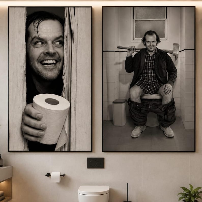 May include: Two black and white wall art prints. The left print shows a man peering through a broken wooden door holding a roll of toilet paper. The right print shows the same man sitting on a toilet holding an axe over his shoulders.
