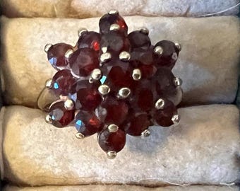 Antique Garnet Cluster Ring in Gold Bezels Size 4.75 was Purchased in Antique Jewelry Store in San Francisco in the 1960's and is Pre Owned.