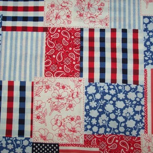 May include: A patchwork fabric featuring a variety of patriotic patterns. The design includes squares with red, white, and blue gingham, stripes, floral prints, paisley, and an American flag motif. The fabric is suitable for quilting and crafting projects.