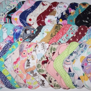 Set of 10  washable , reuseable panty liners with wings 8 inches in random prints
