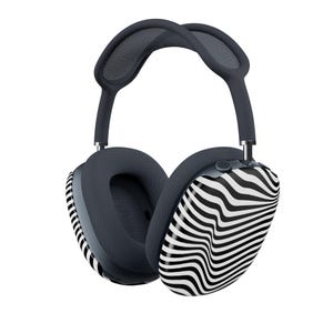 May include: Over-ear headphones with a dark gray headband and earcups. The earcups feature a black and white zebra stripe pattern. The headphones are designed for comfort and style, suitable for music listening or calls.