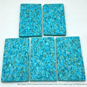 May include: Five rectangular slabs featuring a mosaic pattern of crushed turquoise-coloured stone fragments. Each piece displays a dense, variegated texture with shades of bright cyan, light blue, and earthy tan embedded throughout the surface.