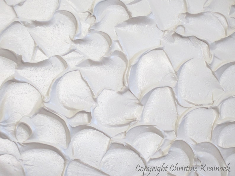 May include: White abstract painting with a textured, raised surface. The paint is applied in thick, swirling strokes, creating a dynamic and organic pattern.
