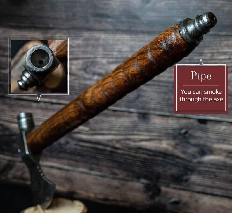 May include: A handcrafted axe with a wooden handle and a metal head. The axe is designed as a pipe, with the text "Pipe" and "You can smoke through the axe" visible.