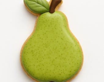 May include: A pear-shaped cookie with green icing and a brown stem and leaf. The cookie has a light brown border and a speckled green surface, resembling a real pear. The cookie is a sweet treat.