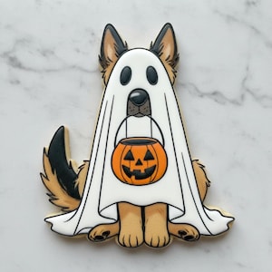 May include: A sugar cookie shaped like a German Shepherd dog wearing a white ghost costume. The dog has tan and black fur, and is holding an orange jack-o'-lantern candy bucket in its mouth. The icing details are outlined in black.