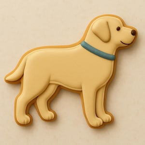 May include: A light yellow Labrador Retriever cookie with a light brown outline and a blue collar. The dog has brown eyes and a smiling expression. The cookie is a treat.