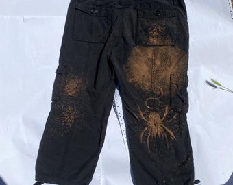 Zwarte lage taille spider capribroek