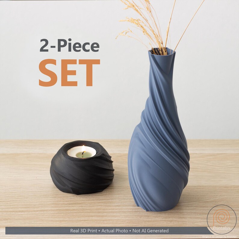May include: A two-piece set comprising a blue vase with a spiral design and a black candle holder. The vase contains dried ornamental grass. The image displays the text "2-Piece SET".