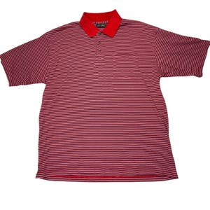 May include: Red and white striped polo shirt with a red collar and pocket. The shirt has short sleeves and a three-button placket. The shirt is made of a soft, breathable fabric.