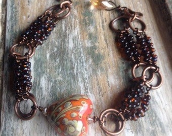 Lampwork heart, farfalle beads and copper bracelet