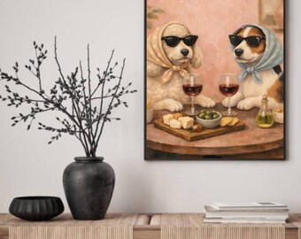 May include: Framed artwork featuring two dogs wearing sunglasses and headscarves, enjoying wine and snacks. The dogs are seated at a table with glasses of red wine, cheese, olives, and crackers. The artwork has a warm, inviting color palette.