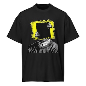 May include: Black t-shirt featuring a graphic design. The design includes a person's head with a yellow square obscuring the face, hands holding the square, and a sweater with the text "Spirit Life".