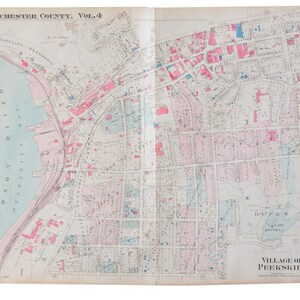 May include: A vintage map of Peekskill, New York, from Westchester County, Vol. 4. The map shows the layout of the town with streets, buildings, and waterways. The map is printed in black and white with pink and blue highlights.