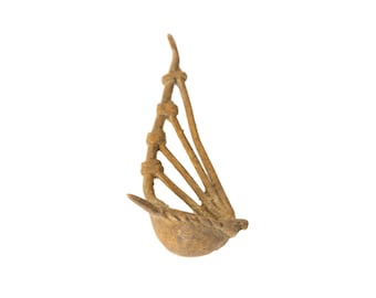 Instrumento musical de bronce africano antiguo