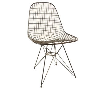 May include: A black wire chair with a metal frame and a wire seat. The chair has a unique design with a star-shaped base.