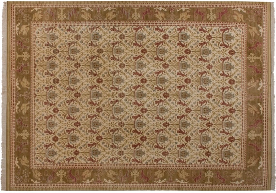 A Spanish Wool Carpet Having Floral Motifs A Spanish Wool Carpet Having Floral Motifs