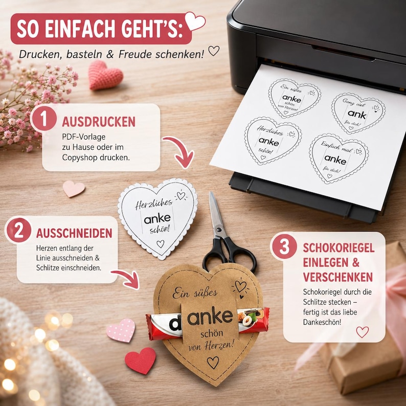 May include: A DIY craft project showing a printer with a sheet of paper featuring four heart-shaped templates with the text 'anke'. A pair of scissors, a cut-out heart, and a brown paper heart holding a chocolate bar with the text 'anke' are shown.