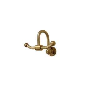 May include: A brass-colored wall hook with a curved design. The hook features a circular mounting plate and two small ball-shaped accents on the ends of the horizontal arms. The hook has a rounded, arched top.