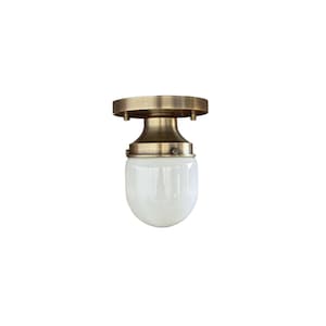 Small ceiling light - with bullet-shaped spherical glass lampshade.