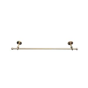 May include: A brass-colored towel bar with a simple, elegant design. The bar is mounted on the wall with two circular brackets. The bar itself is straight, with rounded ends. A classic bathroom accessory.