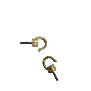 May include: Two brass-colored screw-in hooks with black screws. The hooks have a rounded, curved design, ideal for hanging items. The hooks are shown against a white background.