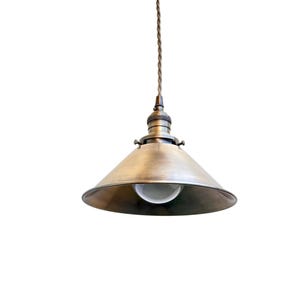 May include: A vintage-style pendant light with a conical, brass-colored shade and a white bulb. The light fixture hangs from a twisted brown cord, perfect for adding a touch of industrial design to any space.