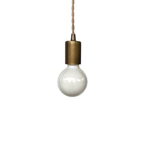 May include: A pendant light fixture featuring a round, frosted white glass bulb attached to a cylindrical, brushed brass socket. The light is suspended from a single, twisted beige fabric cord that extends upward from the top of the metal socket.